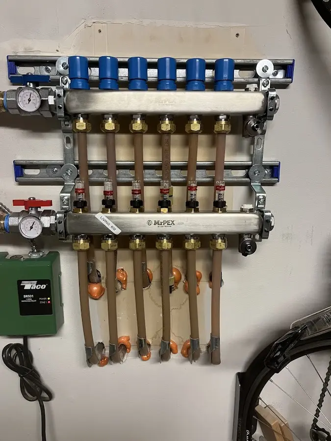 Plumber performing Gas Leak Detection at a residential property in Louisburg